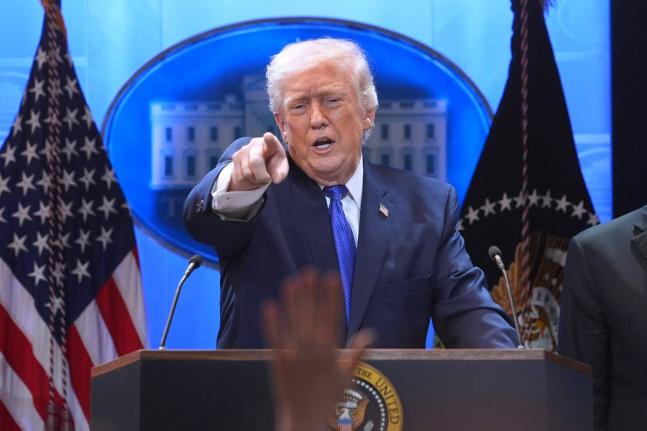 President Donald Trump points to a reporter during a press briefing at the White House, Friday, February 20, 2026, in Washington. (AP Photo/Evan Vucci)