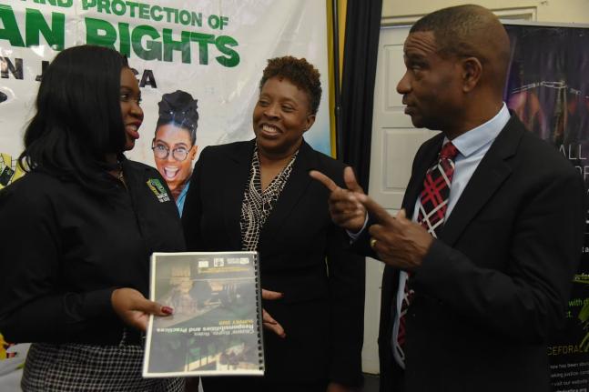 Mickel Jackson (left), executive director of Jamaicans for Justice (JFJ), in discussion with Assistant Commissioner of Police Jacqueline Coombs (centre), and Dr Ashburn Pinnock, president of The Mico University College at the unveiling of the JFJ’s ‘Ci