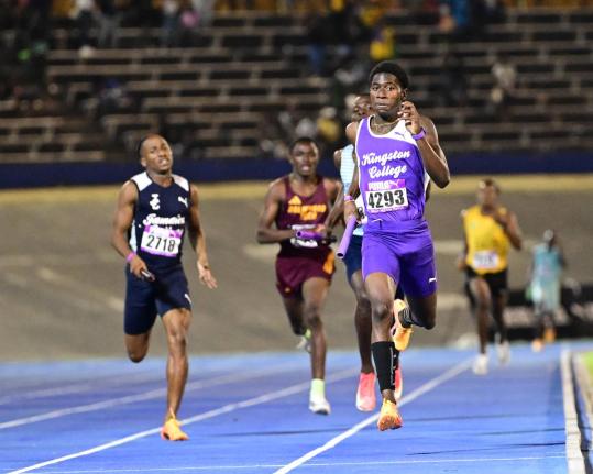 Tahj Marques White of Kingston College leads his school to victory in the high school boys 4x400m Open at last year’s Gibson McCook Relays.