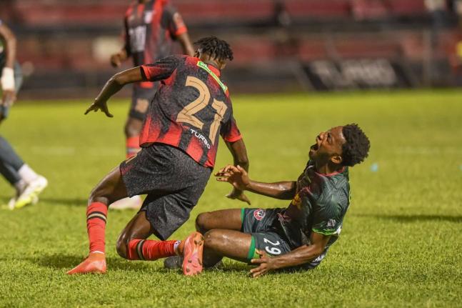 Arnett Gardens Jeremy Nelson (left) leaves Montego Bay United’s Richardo Ramsey in a spot of bother after a challenge in a Jamaica Premier League football game at the Anthony Spaulding Sports Complex on December 15, 2025. 