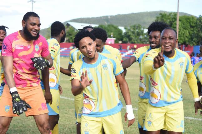 Waterhouse FC players celebrate after scoring against Portmore United during  their Jamaica Premier League football game at the Ferdi Neita Park Sports Complex in Portmore yesterday.