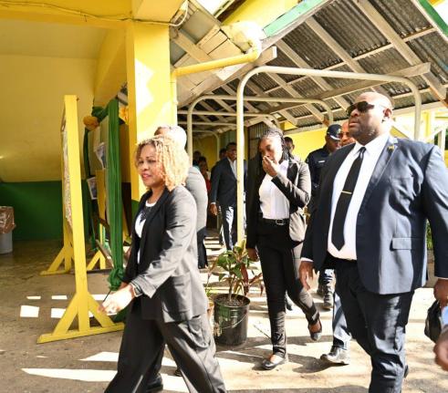 Minister of Education, Skills, Youth and Information, Senator Dr Dana Morris Dixon (left), is joined by Parliamentary Secretary in the Ministry, Senator Marlon Morgan (right), during a visit to the Ocho Rios High School in St Ann on Thursday, March 5,