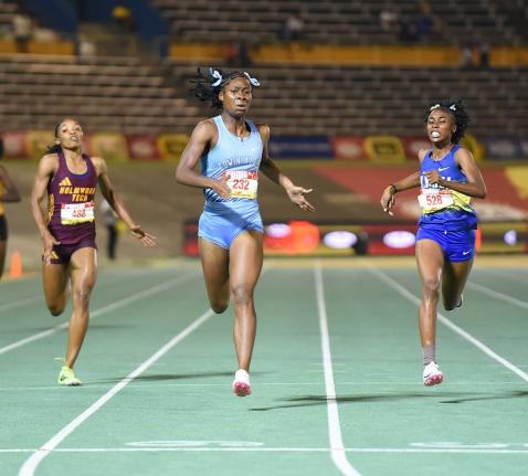 Kelly Ann Carr (centre) from Edwin Allen High  wins the Class One  400 metres in  52.20 seconds on Thursday ahead of Nastassia Fletcher (right) from Hydel High, 52.48 and Abrina Wright (left) of Holmwood Technical who was third in 52.81. 