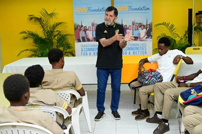 Former Reggae Boyz technical director, Rene Simões, speaks to students at Garvey Maceo High School in Clarendon last year.