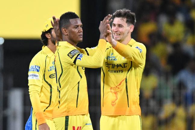 Chennai Super Kings’ Akeal Hosein (centre) celebrates with teammates the wicket of Kolkata Knight Riders’ Angkrish Raghuvanshi during the Indian Premier League cricket match against Kolkata Knight Riders in Chennai, India, yesterday.