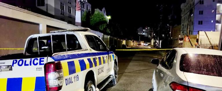 Police on the crime scene in the vicinity of Kensington Court in New Kingston on Friday night.