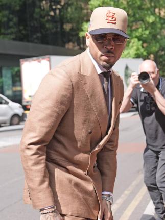 Chris Brown arrives at Southwark Crown Court, where he is charged over an alleged assault in a London nightclub, in London, Friday, July 24, 2026. (Stefan Rousseau/PA via AP)
