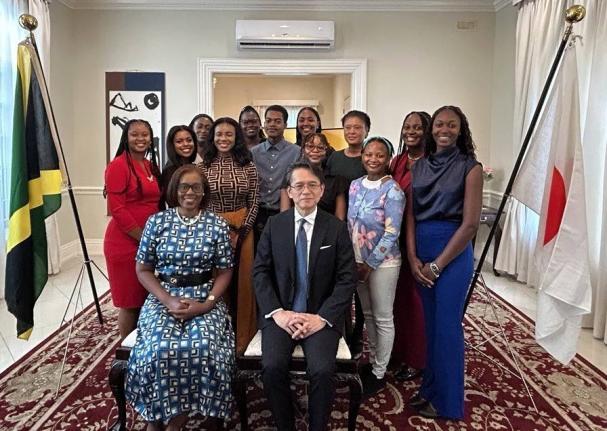 Sheila Sealy Monteith (left), permanent secretary at the Ministry of Foreign Affairs and Foreign Trade, with Ambassador of Japan to Jamaica, Kohei Maruyama, pose for a photograph of the 2026 cohort of JET programme at a send-off reception on Thursday, July