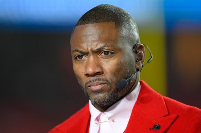 FILE – ESPN Monday Night Football Countdown commentator Ryan Clark looks to the cameras during warmups before an NFL football game between the Kansas City Chiefs and the Washington Commanders, Oct. 27, 2025 in Kansas City, Missouri. 