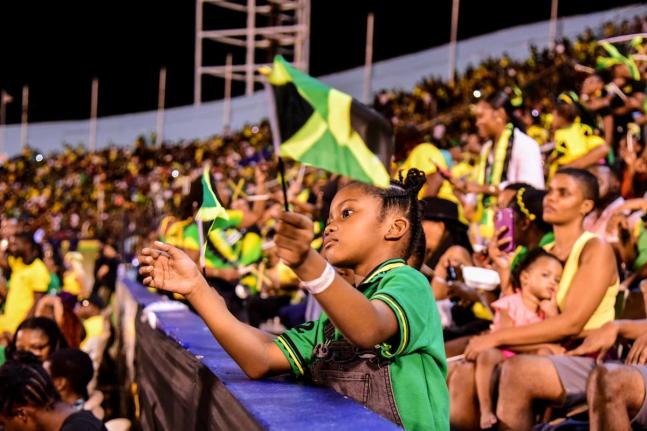 A little girl enjoying the Grand Gala celebrations at the National Stadium. 