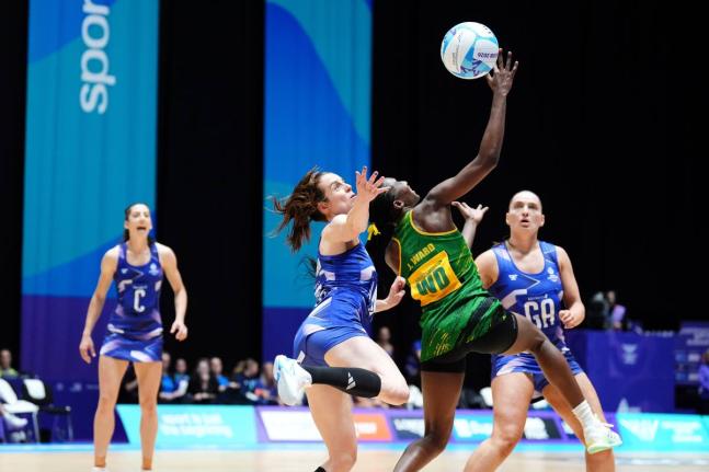 Iona Christian of Scotland (centre left) and Jodi-Ann Ward of Jamaica in action during the Netball Preliminary Round Pool B match at the Commonwealth Games in Glasgow, Scotland on Wednesday. Jamaica won 45-43.