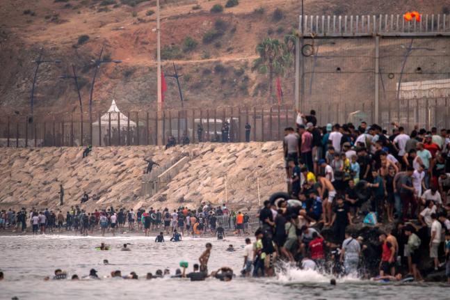 Migrants return to Morocco from the Spanish enclave of Ceuta, on Friday. - AP photo