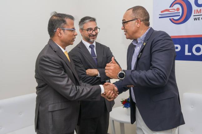 Dr Ravi Prakash Sangappa (left), chief executive officer, Oasis Imaging Centre; is greeted by Dr Christopher Tufton (right), minister of health and wellness; while Mayank Joshi, high commissioner of India to Jamaica, looks on during the official inaugurati