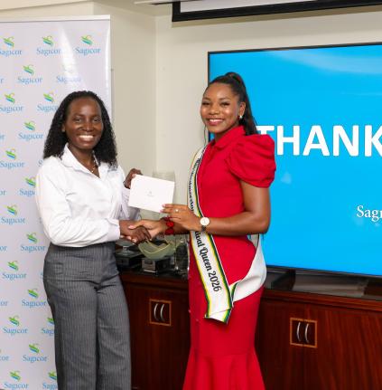 Shanique Sommerville, Miss Westmoreland Festival Queen 2026 (right), receives a cash voucher to start a Sagicor Bank Jamaica savings account from Kerry-Ann Brainsford, manager, commissioned sales, Sagicor Bank, during the Financial Literacy Training Sessio