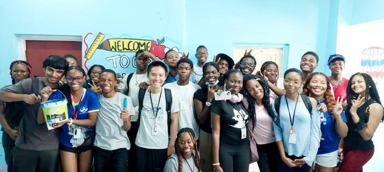 Students of the JamCoders Summer Camp pose for a group photo at the August Town Church of Christ Basic School.
