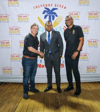 Directors of the Treasure Beach Food, Rum & Reggae Festival, Gregory Wright (far right) and Jason Henzell (far left) are joined by Minister of Agriculture, Fisheries and Mining Floyd Green, at the launch of the 2025 event. The festival organisers recently 