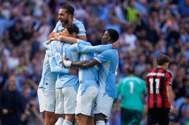 Manchester City’s players celebrate after Josko Gvardiol  scored his side’s second goal during the English Premier League match between Manchester City and Bournemouth in Manchester, England yesterday.