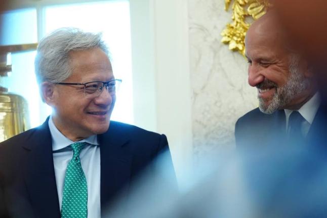 NVIDIA CEO Jensen Huang talks with Commerce Secretary Howard Lutnick as President Donald Trump speaks in the Oval Office of the White House about Dulles International Airport modernization, Wednesday, July 29, 2026, in Washington, USA. 