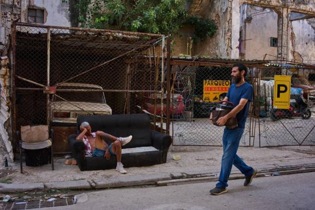 A man rests on a sofa on a street in Havana, Cuba, August 27.
