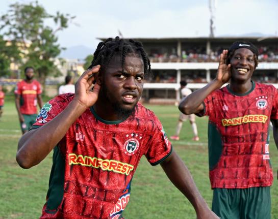 Montego Bay United's Dwight Merrick (left) and teammate Deonjay Brown  celebrate a goal during their Jamaica Premier League football match against Chapelton Maroons at Jarrett Park on September 13. 