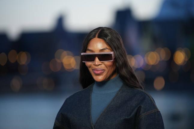 Naomi Campbell has a reason to smile after she won a legal challenge on Thursday to overturn a five-year ban on serving as a charity trustee in England and Wales. 