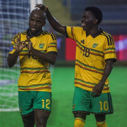 Reggae Boy Javon East (left) is congratulated by teammate, Kaheim Dixon, for scoring one of his two goals against El Salvador during their Concacaf Nations League A Group B clash at the Estadio Cuscatlán in San Salvador earlier tonight.