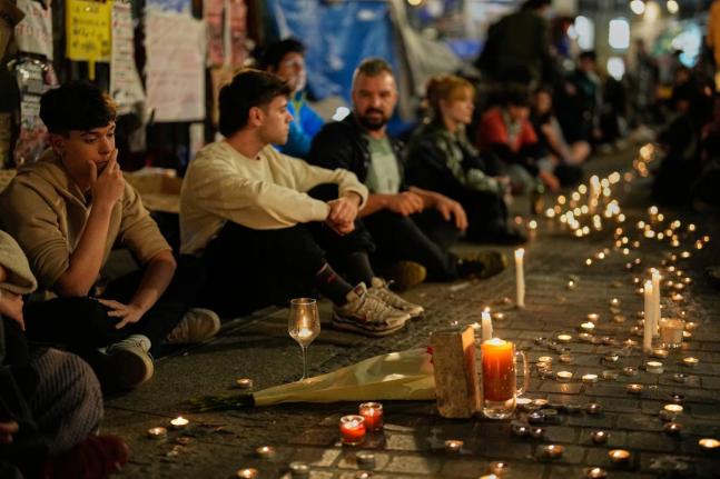 Protesters gather after the reported death of María del Carmen Abascal, the 87-year-old woman whose eviction sparked nationwide protests, in Puerta del Sol square in Madrid, Wednesday.