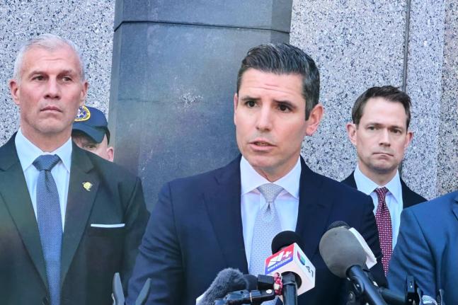 US Attorney Jamie McDonald speaking to reporters outside a federal courthouse following the announcement of new charges against former Venezuelan President Nicolás Maduro Thursday.