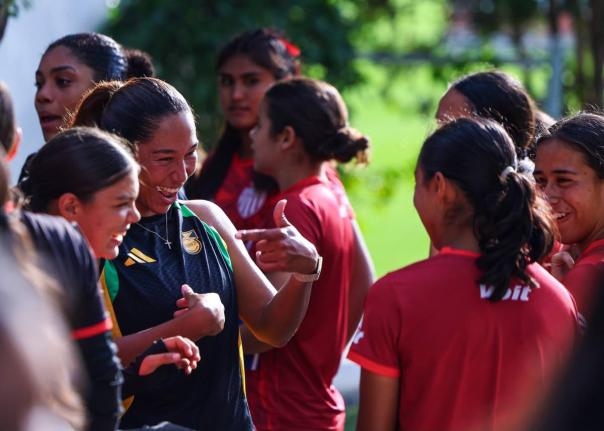 
Reggae Girlz (left) greet their Mexican counterparts ahead of the first of two friendlies between the teams on Friday. The Reggae Girlz won the game 4-3.