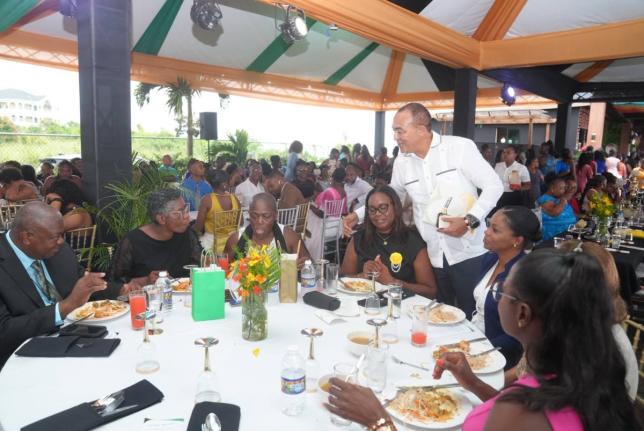 Health and Wellness Minister Dr Christopher Tufton interacts with healthcare workers from the Southern Regional Health Authority during an appreciation gala last week.