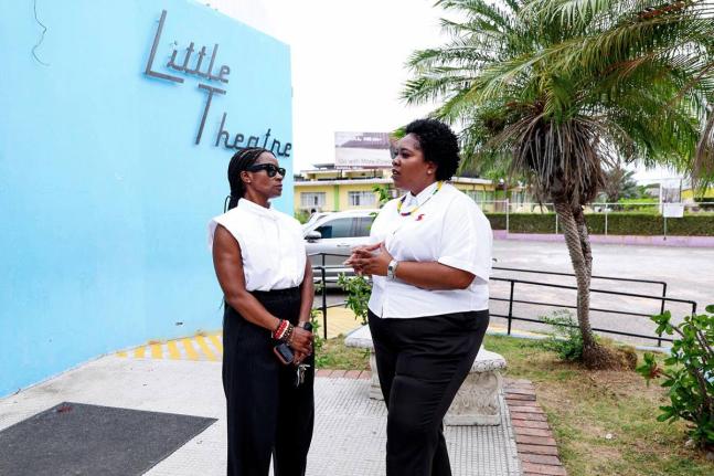 Chair of the Little Theatre Foundation, Marisa Benain (left) and Executive Director of the Scotiabank Jamaica Foundation, Deleen Powell, discuss plans for the Scotiabank-funded sound and technical production programme during a recent tour of the facility.