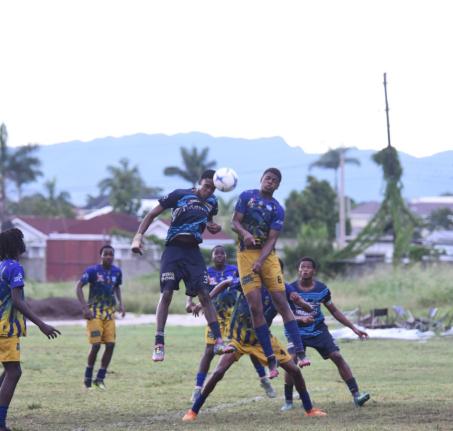 The Manning’s School’s Leanthony Coley (left) and Brown’s Town High’s Dejaunie Falconer compete for a header during their ISSA daCosta Cup football match at Manning’s yesterday.