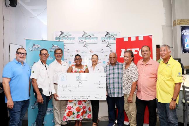 Charles Ross (third left), president and chief executive officer of Sterling Asset Management, title sponsor of the tournament, presents a cheque for $2 million to Marsha Burrell-Rose (fourth left), development and marketing manager at Food For The Poor Ja