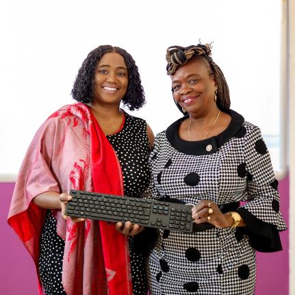 Nicole Patrick-Shaw, deputy director of the Institute of Jamaica, and Dr Martha Corbett-Baugh, founder, chief executive officer and academic director of the Caribbean Training Institute for Languages (CTIL), display a Spanish-language keyboard during a rec