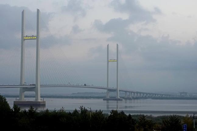 The China-North Korea Yalu River Bridge is seen from Dandong, China, at the border between the two countries.