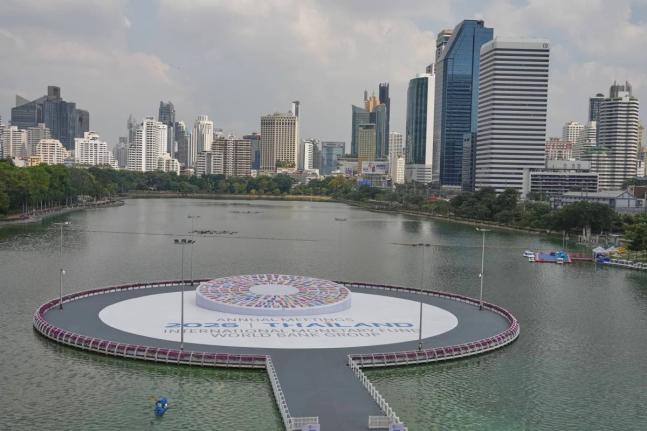 
A person stands next to the logo of the 2026 IMF-World Bank Annual Meetings, ahead of the meeting at Queen Sirikit National Convention Center in Bangkok, Thailand, on October 9.