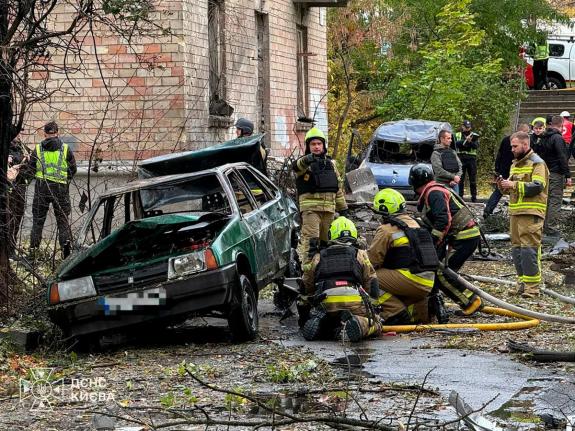 Ukrainian emergency services personnel work in residential neighbourhood following a Russian air attack in Kyiv, Ukraine on Thursday.