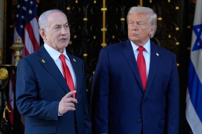 In this Devember 2025 file photo, United States President Donald Trump listens as Israel’s Prime Minister Benjamin Netanyahu speaks at Trump’s Mar-a-Lago club in Palm Beach, Florida.