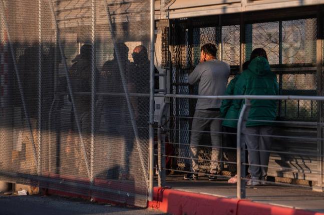 A group of undocumented migrants is deported by US Immigration and Customs Enforcement agents across the McAllen–Hidalgo–Reynosa International Bridge in McAllen, Texas, March 13.