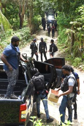 Members of the Jamaica Constabulary Force (JCF), are seen in Five Miles in Sligoville, St. Catherine.