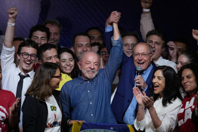 President Luiz Inacio Lula da Silva celebrates with his running mate Geraldo Alckmin after winning a fourth term in the presidential runoff in Brazil on Sunday.