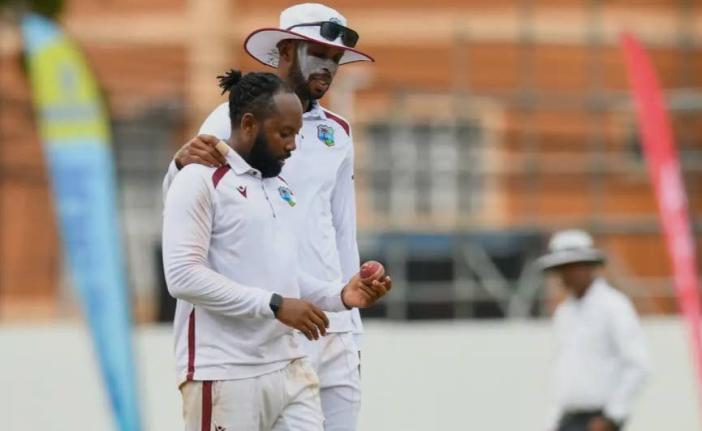 Jomel Warrican (left) and Roston Chase shared five wickets between them to leave Bangladesh 79 for six.
