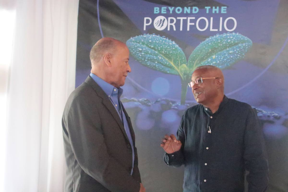 Oliver Holmes (left), managing director for Capital Options Limited, shares a moment with Mark Berry, vice chairman of Mayberry Investments Limited, during the firm’s latest client event. Held at the Terra Nova All Suite Hotel in St Andrew on September 2