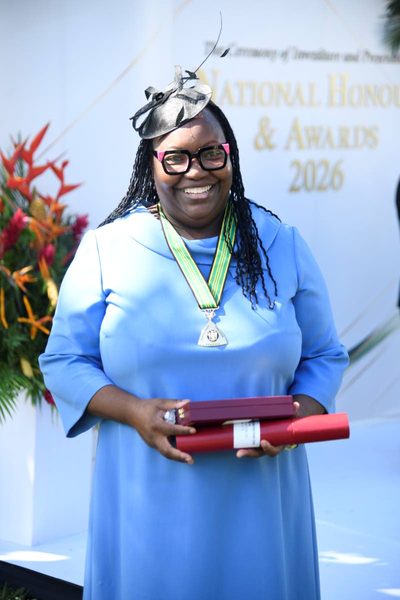 Claudette Thompson, director of public prosecutions, poses for a photograph after being conferred with the Order of Distinction in the Rank of Commander during the National Honours and Awards Ceremony.