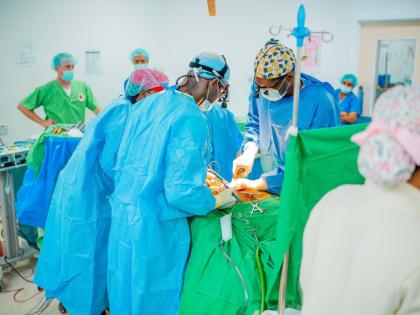 Doctors performing spine surgery at the University Hospital of the West Indies earlier this month. 