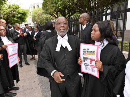 Christopher Townsend (second right), Tamika Harris (right), president of Advocates’ Association of Jamaica, along with several other attorneys-at-law during silent protest last week.