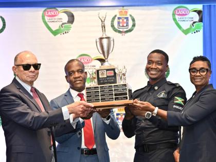 From left: James E.D. Rawle, executive chairman of LASCO Affiliated Companies; Dr Kevin Blake, commissioner of police; and Juliet Cuthbert-Flynn (right), minister of state in the Ministry of National Secutrity and Peace, present the LASCO JCF Chairman’s 