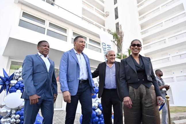 Prime Minister Dr Andrew Holness (second left) takes the tour with (from left) Phillip Paulwell, member of parliament for Kingston East and Port Royal; Richard Lake, director of Sherbourne Limited; and Lisa Hanna, wife of Richard Lake, after cutting the ri