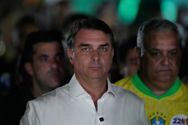 Opposition presidential candidate Sen. Flavio Bolsonaro arrives at his election night event after the presidential runoff in Brasilia, Brazil, Sunday.